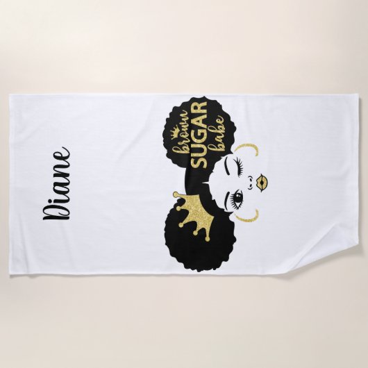 Bruine suikerbaby in zwart en goud strandlaken (Voorkant)