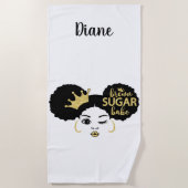 Bruine suikerbaby in zwart en goud strandlaken (Voorkant)