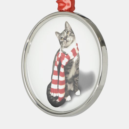 Bruine tablet in een rode en witte sjaal metalen ornament (Links)