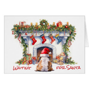 Bulldog wachten op Kerstmis open haard