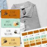 Bumble Bee Honey and Green Clothing Kinderlabels<br><div class="desc">Honingbijen worden voorzien van speciale kinder keurmerken - waterdichte kledingetiketten die u kunt aanpassen met maximaal vier verschillende namen. Het neutrale collectie in tinten honing, wit en groen is perfect als je code voor je jongens en/of meisjes wilt kleuren. De stickers zijn versierd met hommels en de sjabloon is ingesteld...</div>