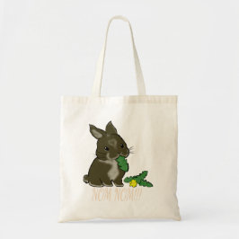 Bunny eating dandelion tote bag