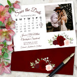 Burgundy Red & Roses Wedding Calendar & Photo Save The Date<br><div class="desc">Deze prachtige bruiloft Save the Date-kaart is voorzien van een roestachtig boho-chic-ontwerp met scriptletters en een cluster van handbeschilderde waterverf-rozen in tinten van bruine, rode en wazige roze. Er is een aanpasbare kalender waar je je hart kunt leggen rond je trouwdatum met ruimte voor je foto, de naam van het...</div>