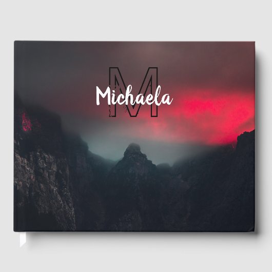 Burning clouds, fog and mountains monogram in sky gastenboek (Voorkant)