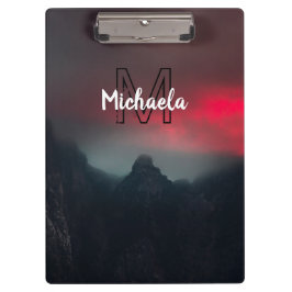 Burning clouds, fog and mountains monogram in sky klembord