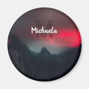 Burning clouds, fog and mountains monogram in sky magneet