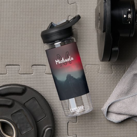 Burning clouds, fog and mountains monogram in sky waterfles (Gym)