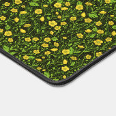 Buttercups op zwart bureaumat (Hoek)