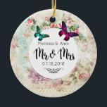 Butterflies on Shabby  Collage Mr. en Mrs. Keramisch Ornament<br><div class="desc">Een bruiloft ornament ontworpen met vlinders in roze magenta en smaragdgroen. Een wit cirkelvormig lijst met je trouwgegevens,  gelaagd boven een schuin  collage met roze rozen en andere decoratieve elementen. Mr en Mrs. geschreven in een fancy trendy scriptlettertype. Een ouderwetse chic.</div>