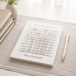 Cadeaubloemen voor leraren in een stapel boeken notitieblok