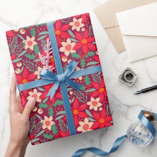 Cadeaupapier voor kerst met rode poinsettia.
