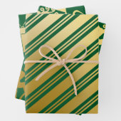 Cadeaus met groene gouden rendieren met kerstmis inpakpapier vel (In situ)