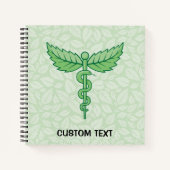 Caduceus met achtergrond van bladeren notitieboek (Voorkant)
