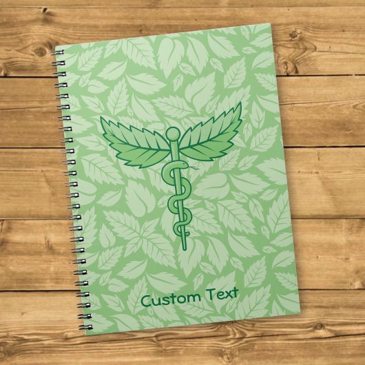 Caduceus met Bladeren Achtergrond Notitieboek