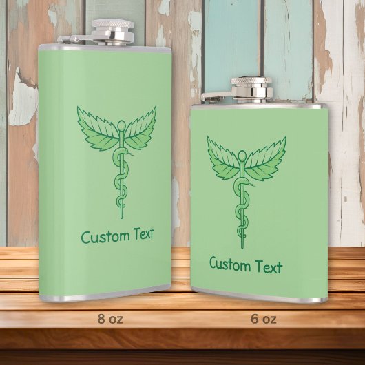 Caduceus met bladeren heupfles