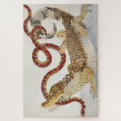 Caimans die een oranje en zwarte slang eten legpuzzel (Verticaal)