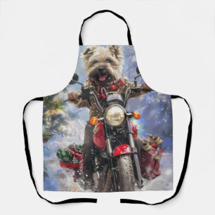 Cairn Terrier-hond rijdt op motorfiets met Kerstmi Schort