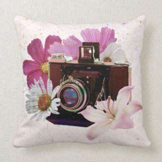 camera met bloemen kussen
