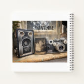  camera's en  afdrukken notitieboek (Achterkant)