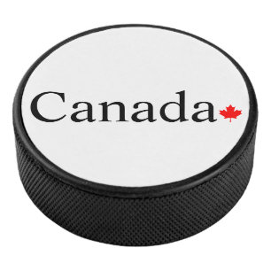 Canada typografie met rode esdoorn blad hockey puck
