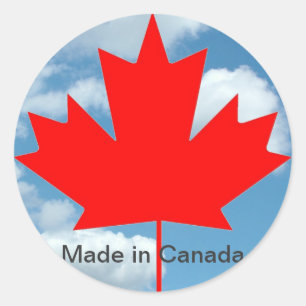 Canadese vlag en blauwe lucht, gemaakt in Canada Ronde Sticker