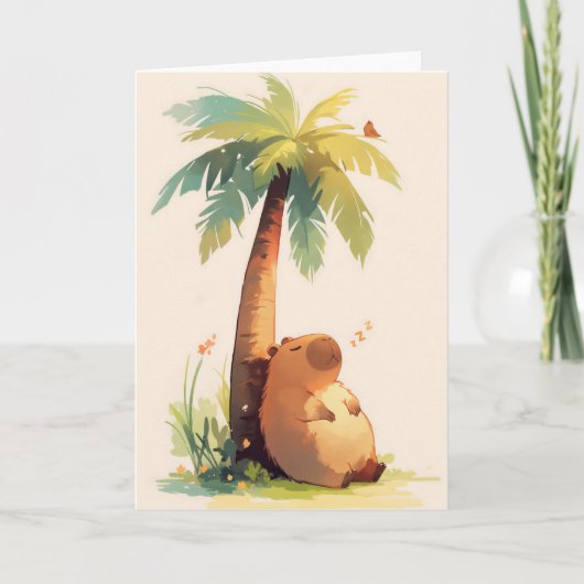 Capybara die een dutje doet onder een palmboom kaart (Voorkant)