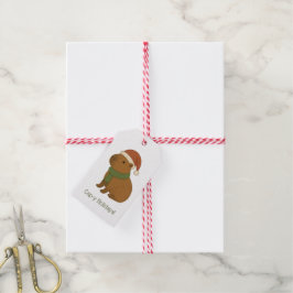 Capybara tijdens de kerst cadeaulabel