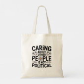 Caring Isn't Political — Minimalist Statement Tote Bag (Achterkant)