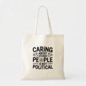 Caring Isn't Political — Minimalist Statement Tote Bag (Voorkant)