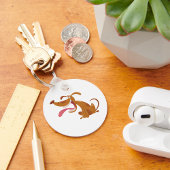 Cartoon hond met grote glimlach en tong uit sleutelhanger