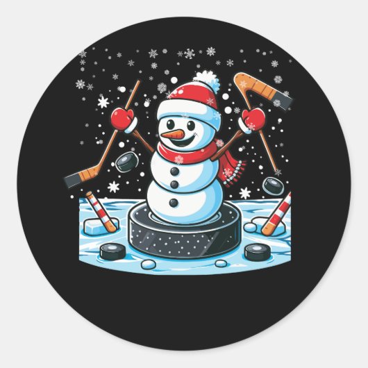 Cartoon ijshockey puck sneeuwman met kerstmuts chr ronde sticker (Voorkant)