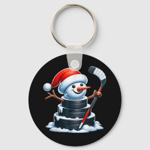 Cartoon ijshockey puck sneeuwman met kerstmuts chr sleutelhanger