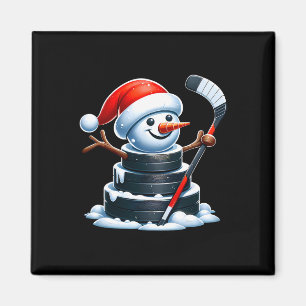 Cartoon-ijshockeypuck-sneeuwman met kerstmannenhoe magneet