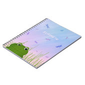 cartoon kikker die door graslibellen naar het gras notitieboek (Linkerzijde)