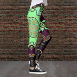 Cartoon Mandala Flower Green Paars and Black Leggings<br><div class="desc">Dit funky mandala-bloemontwerp biedt groene,  paarse en zwarte cartoon. Drijvende geometrische visuals voor de moderne hippie of het liefhebber van levendige kleuren!</div>