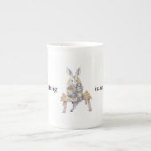 Cartoon van Aardvark, zittend en drink van een mok (Voorkant)