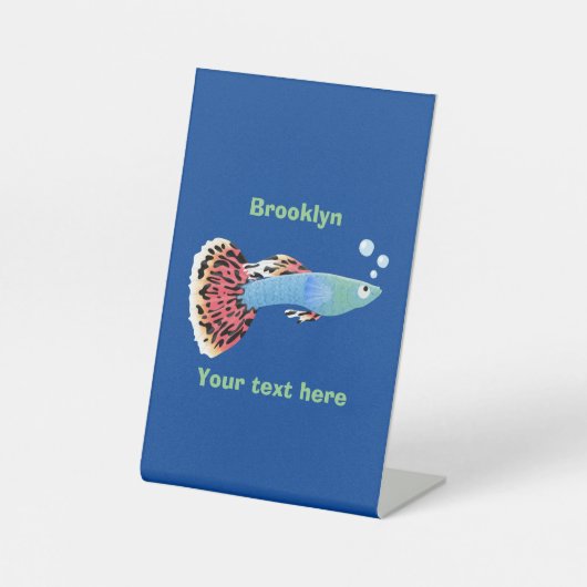 Cartoon van fancy guppy tropische vissoorten reclamebord met voetstuk (Voorkant)