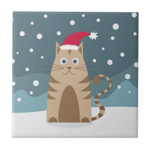 Cartoon xmas kat met een kerstmanhoed op sneeuw tegeltje