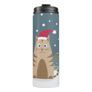 Cartoon xmas kat met een kerstmanhoed op sneeuw thermosbeker
