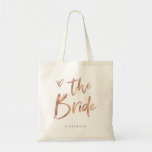 Casual Script | Chic Roos Gold Bride Tote Bag<br><div class="desc">Deze stijlvolle en schitterende bridale cadeautas is uitgerust met een moderne,  casual faux roos gouden scripttypografie die "Bride" zegt,  en een trendy gekrabbeld hart,  met haar naam in gewone vetgedrukte tekst. Het perfecte cadeau voor de nieuwe bruid.</div>