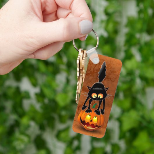 Cat Halloween Scared Cartoon op pompoen Sleutelhanger (Hand)