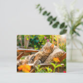 Cat sleeping in garden chair among flowers feestdagenkaart (Staand voorkant)