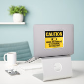 Caution Sign – Needs Recharge After Socializing Sticker (Laptop op bureau)
