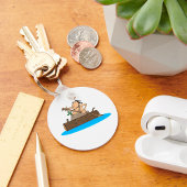 Caveman in een kano sleutelhanger