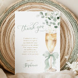 Champagne Greenery Thank You Card Bedankkaart<br><div class="desc">Send a touch of botanical beauty and heartfelt thanks with these exquisite bridal shower thank you cards. The design features a captivating illustration of a champagne flute, elegantly tied with a sage green ribbon and surrounded by a garland of fresh eucalyptus. The delicate script and the natural, airy aesthetic provide...</div>