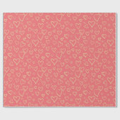 Charmante gouden harten op een warme perzik achter cadeaupapier (Vlak)