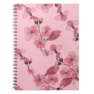 Cherry bloesem in roze kleur op witte achtergrond. notitieboek