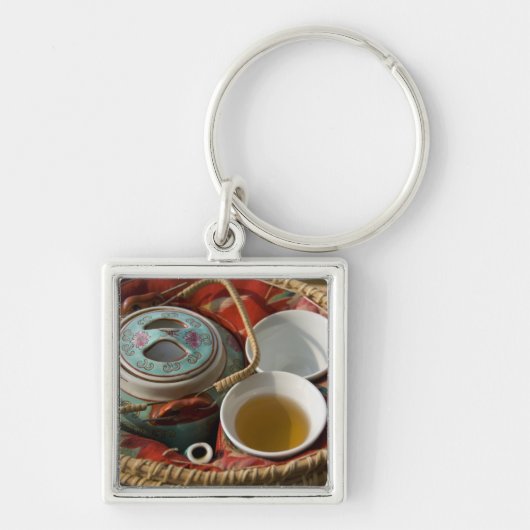 China, Hong Kong. Traditionele Chinese theepot & 3 Sleutelhanger (Voorkant)