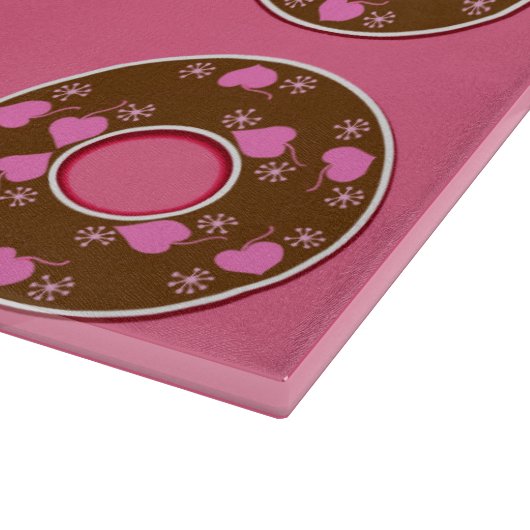 Chocolade donuts donuts donuts op roze snijplaat snijplank (Hoek)