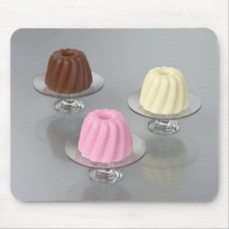 Chocolade-, vanille- en aardbeipudding in glas muismat